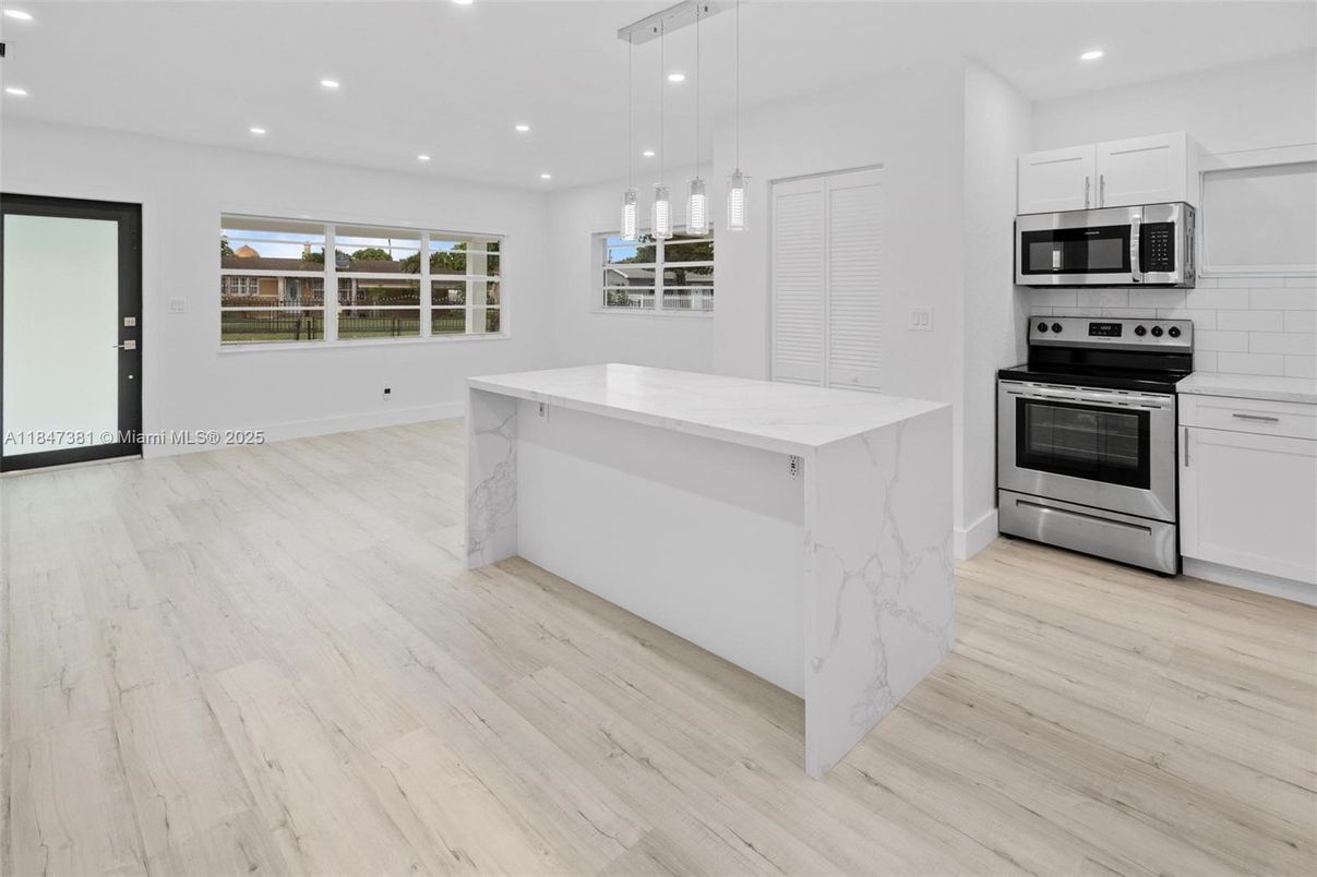 Interior, Kitchen, Pendant Lights, Recessed Lighting, Stainless Steel Appliances, Wood Texture Flooring