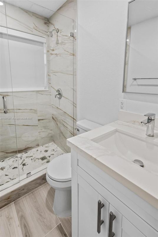 Bathroom, Glass Shower, Interior, Marble Walls, Wood Texture Flooring