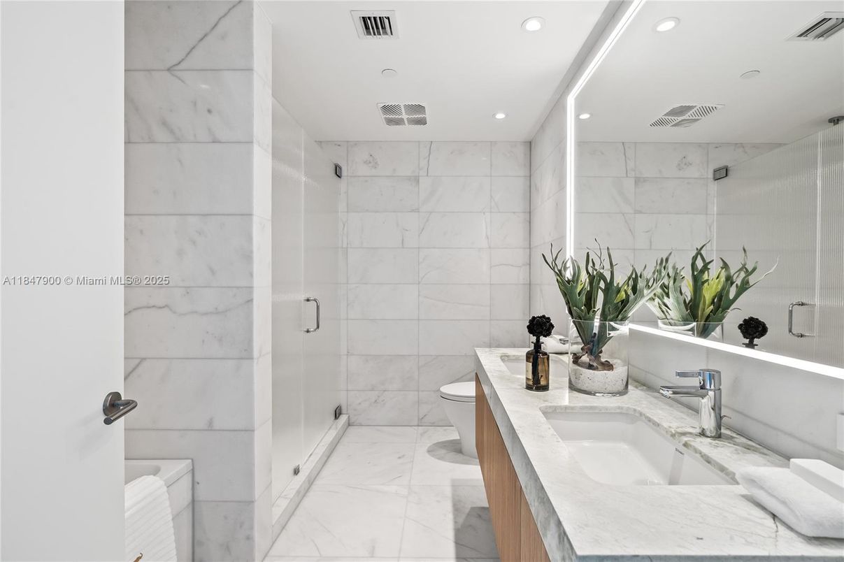 Bathroom, Dual Sink Vanities, Glass Shower, Interior, Marble, Marble Walls, Recessed Lighting