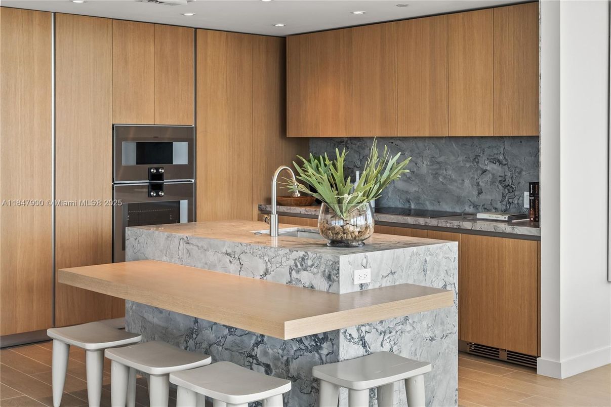 Interior, Kitchen, Marble Walls, Recessed Lighting, Stainless Steel Appliances, Wood Texture Flooring