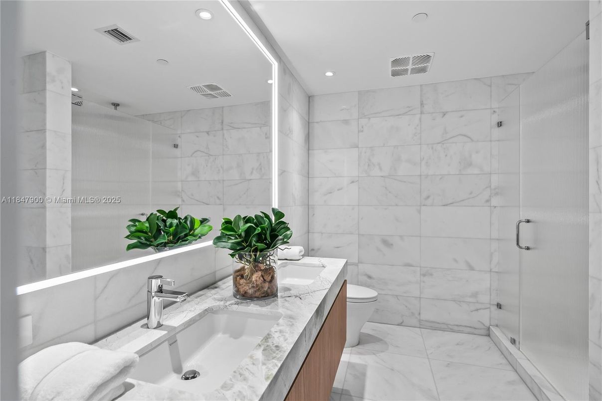 Bathroom, Dual Sink Vanities, Glass Shower, Interior, Marble, Marble Walls, Recessed Lighting