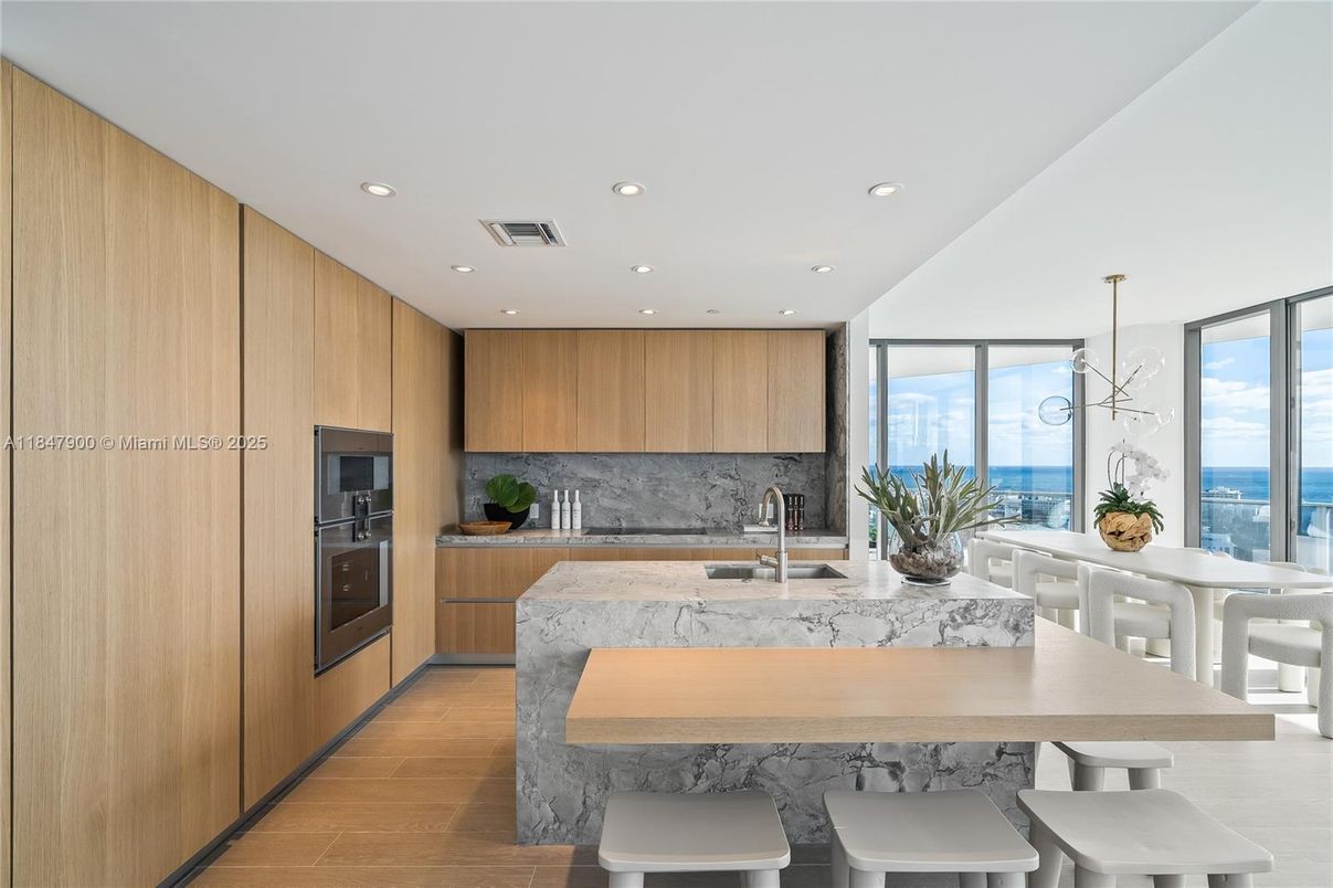 Dining room, Interior, Kitchen, Pendant Lights, Recessed Lighting, Stainless Steel Appliances, Water, Wood Texture Flooring