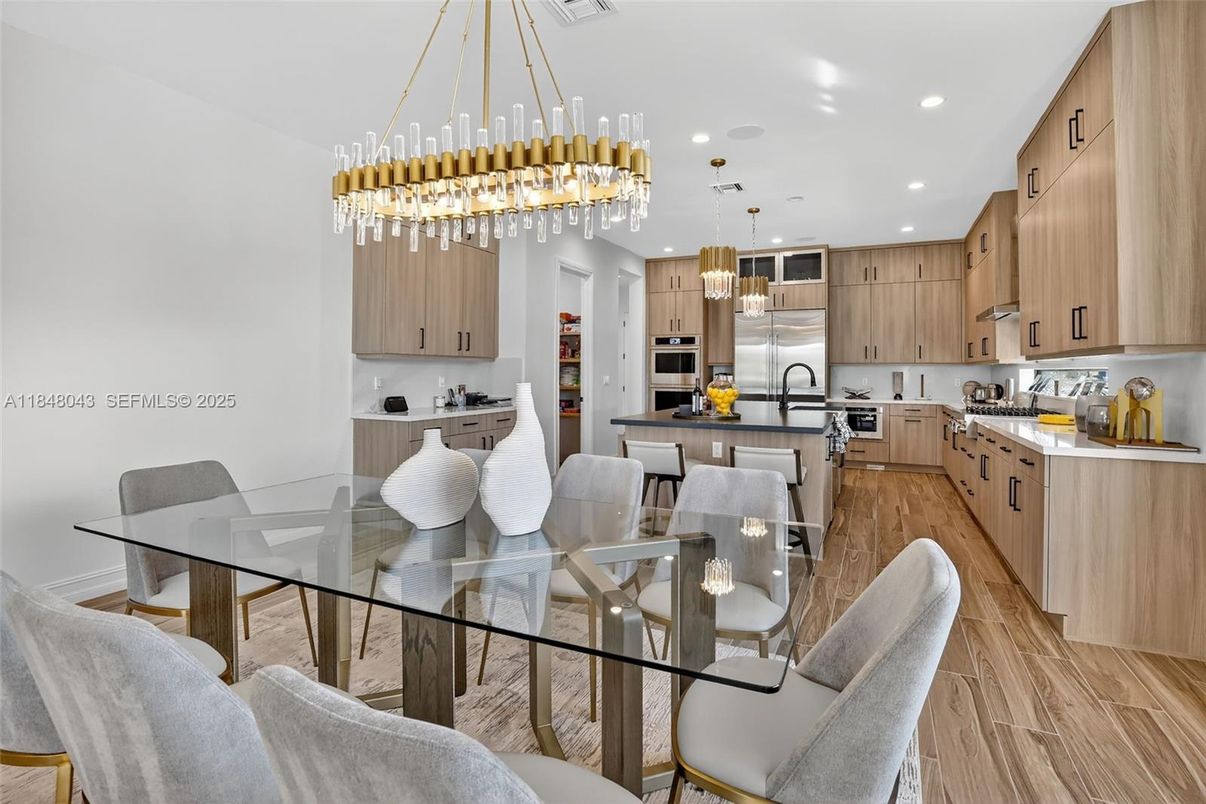 Dining room, Interior, Kitchen, Pendant Lights, Recessed Lighting, Stainless Steel Appliances, Wood Texture Flooring