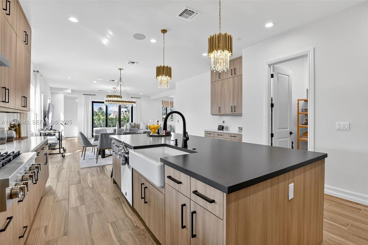 Chandelier, Dining room, Interior, Kitchen, Pendant Lights, Recessed Lighting, Stainless Steel Appliances, Wood Texture Flooring