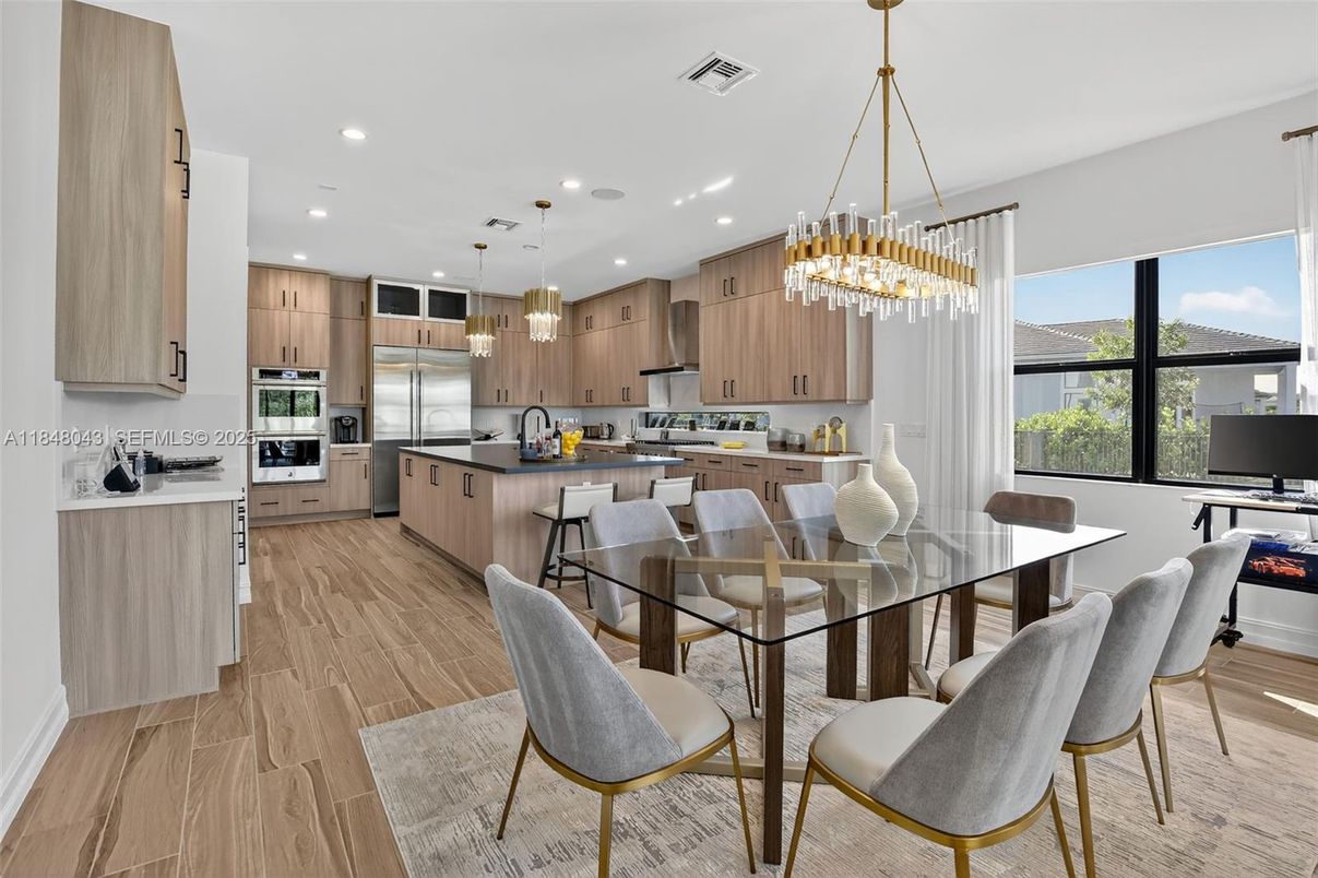 Chandelier, Dining room, Interior, Kitchen, Pendant Lights, Recessed Lighting, Stainless Steel Appliances, Wood Texture Flooring