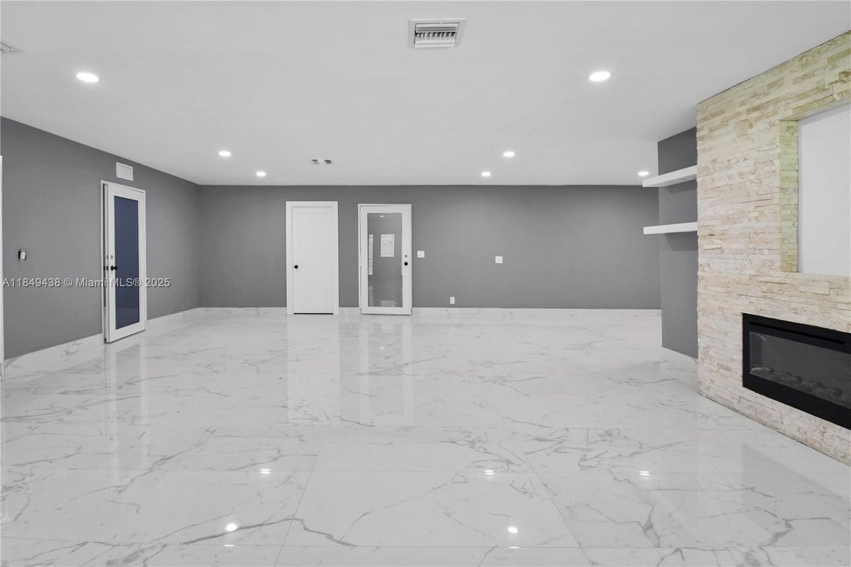 Empty room, Fireplace, Interior, Marble, Recessed Lighting, Stone Walls