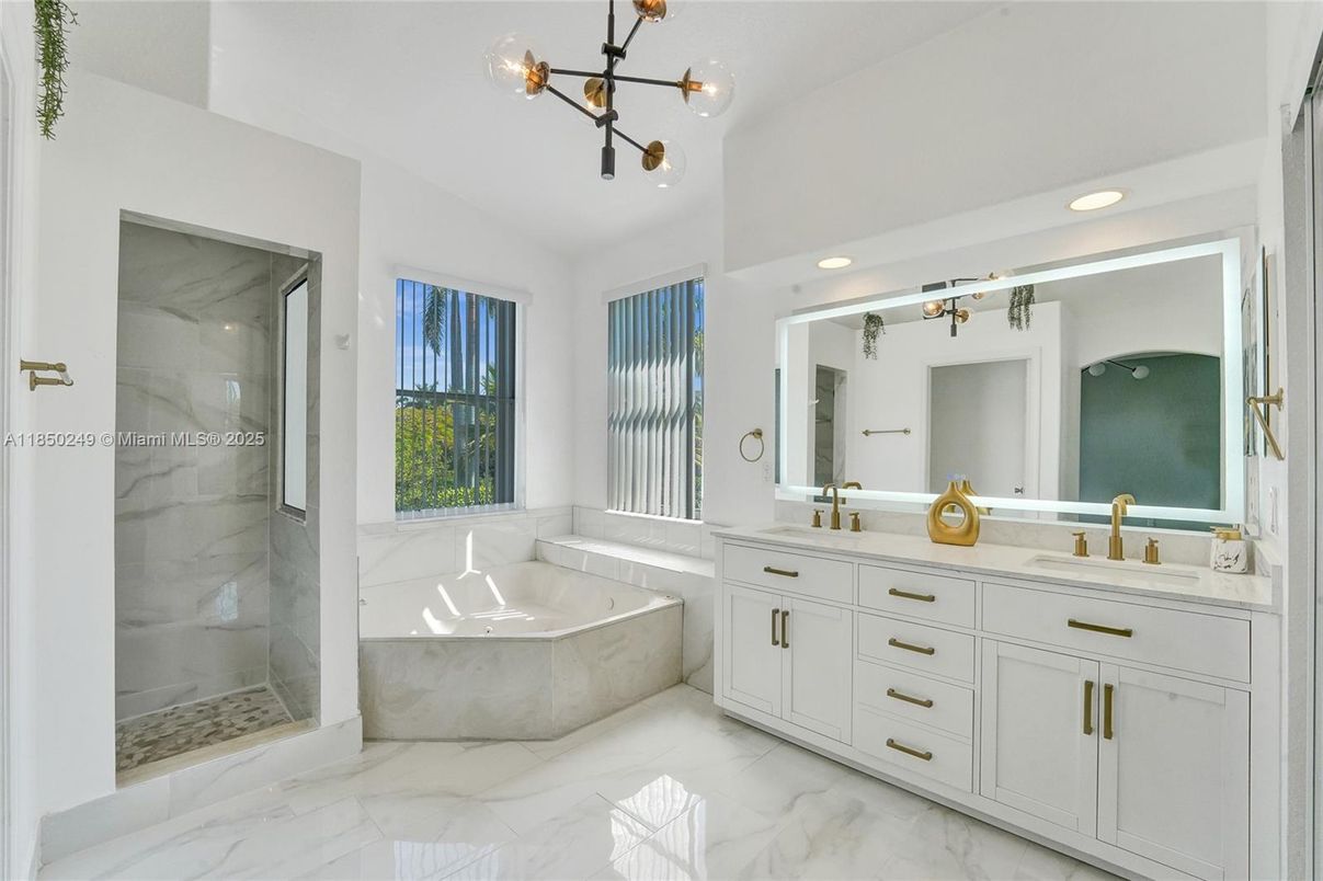 Bathroom, Dual Sink Vanities, Glass Shower, Interior, Marble, Marble Walls, Recessed Lighting