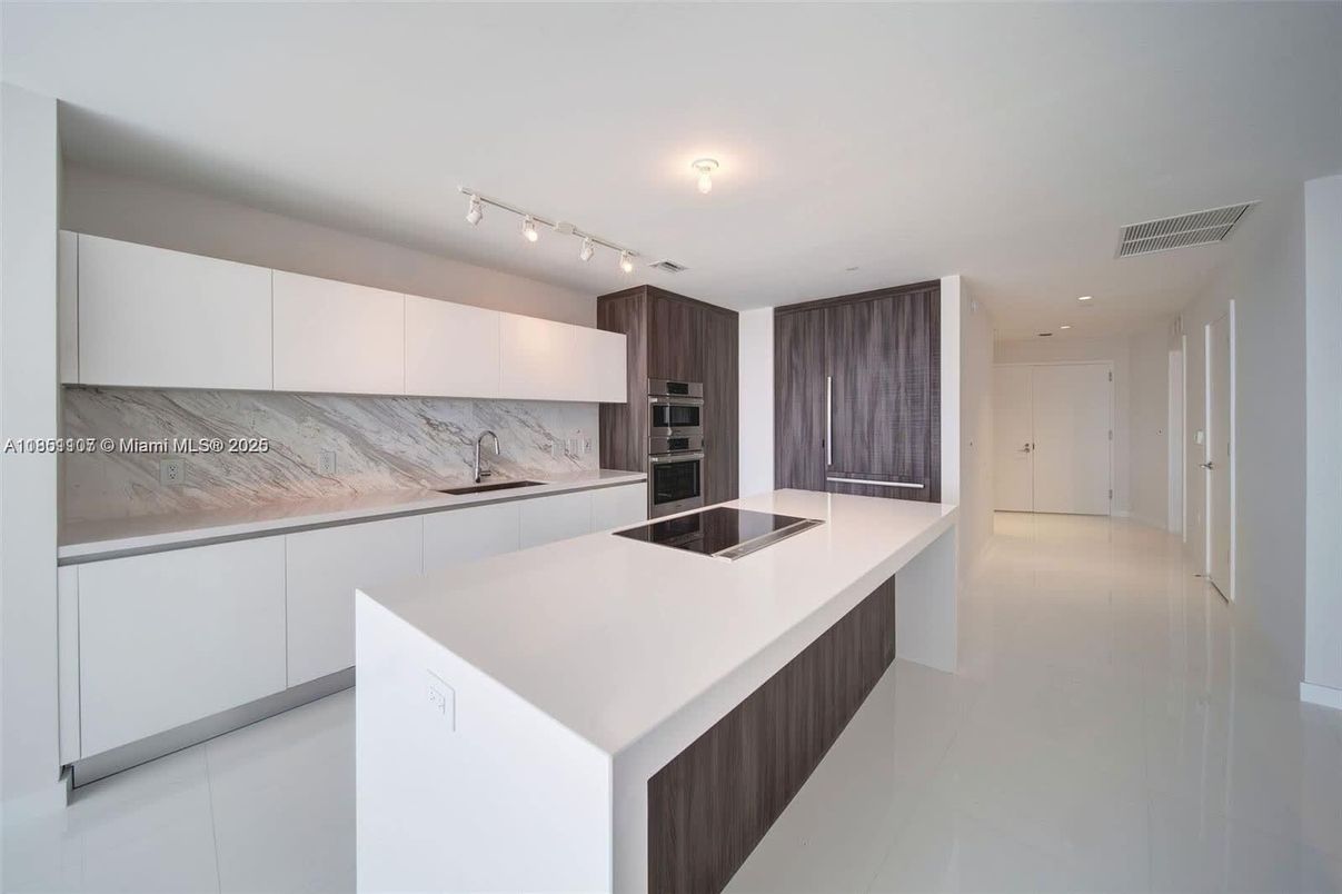 Interior, Kitchen, Marble Walls, Recessed Lighting, Stainless Steel Appliances