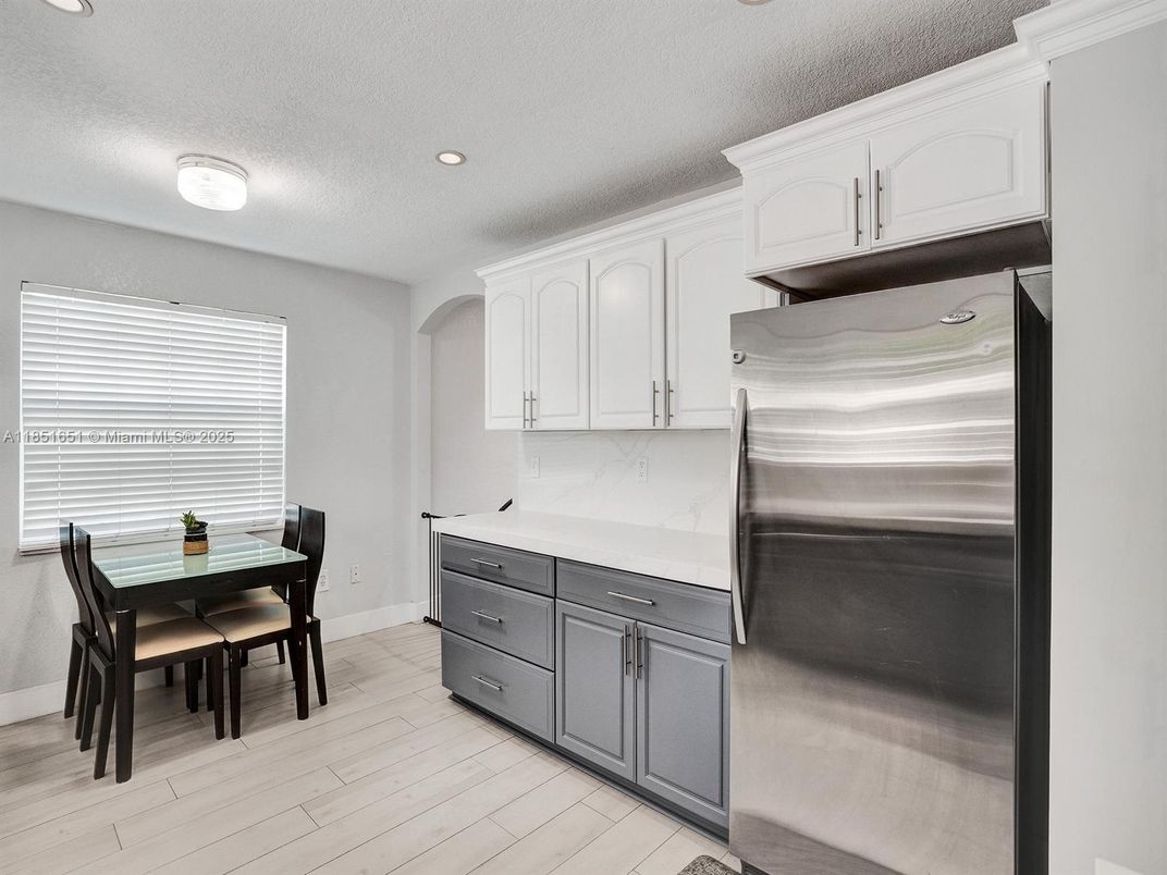 Dining room, Interior, Kitchen, Recessed Lighting, Stainless Steel Appliances, Wood Texture Flooring