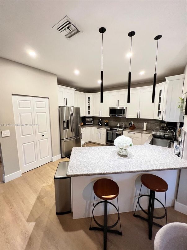 Interior, Kitchen, Pendant Lights, Recessed Lighting, Stainless Steel Appliances, Wood Texture Flooring