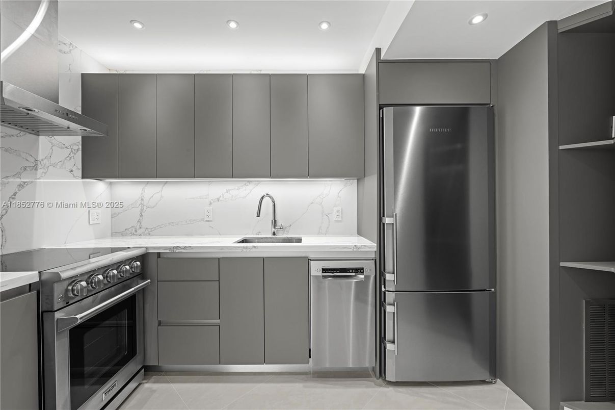 Interior, Kitchen, Marble Walls, Recessed Lighting, Stainless Steel Appliances