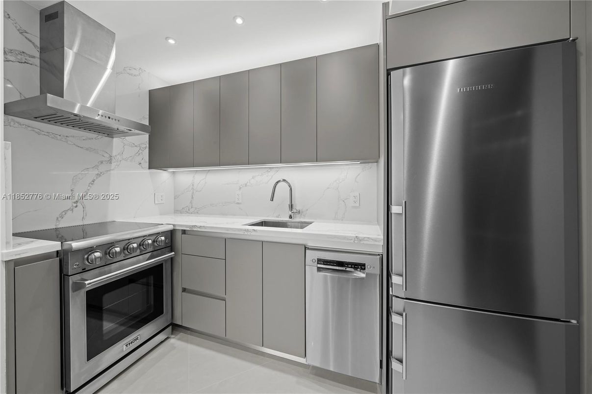 Interior, Kitchen, Marble Walls, Recessed Lighting, Stainless Steel Appliances