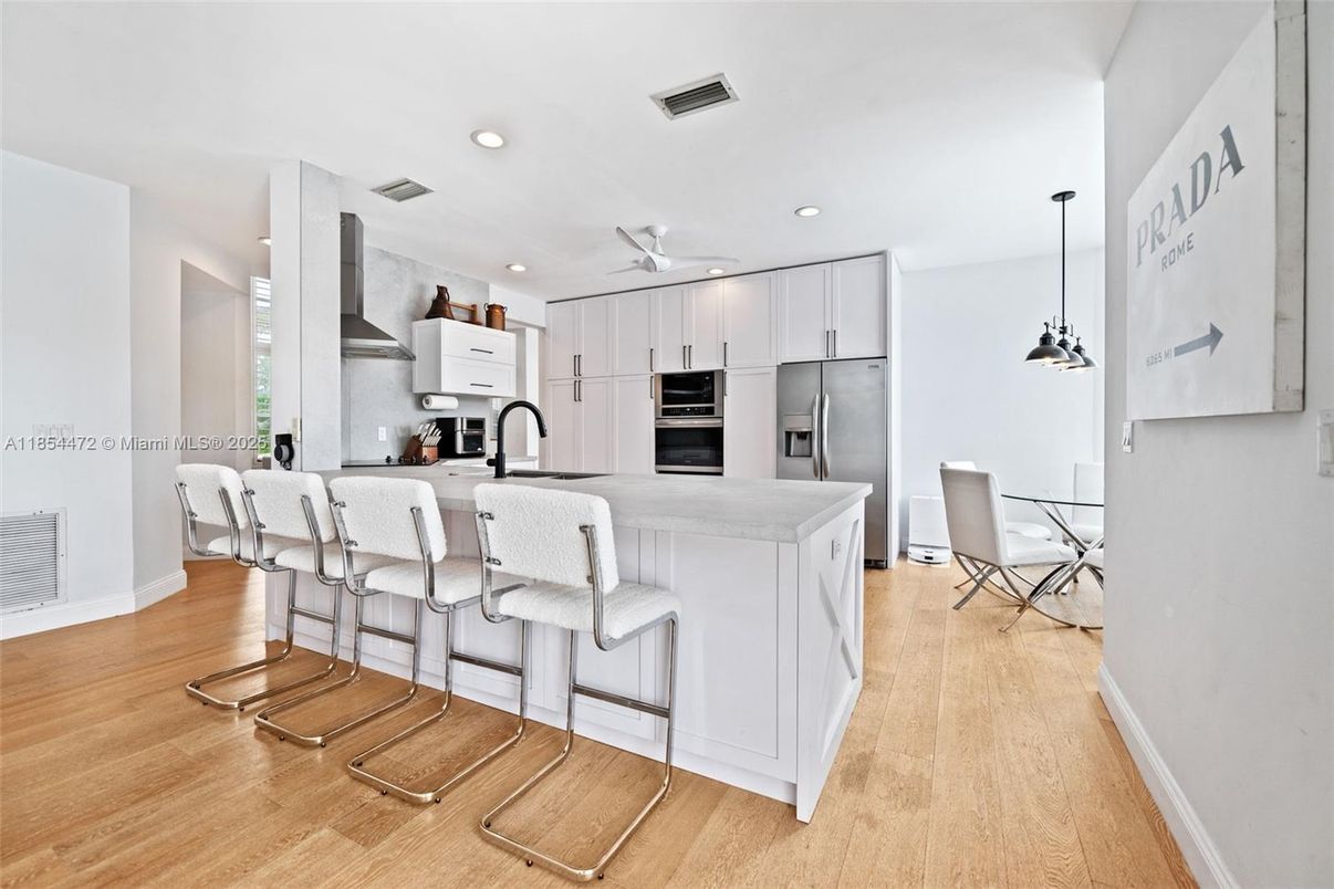 Dining room, Interior, Kitchen, Pendant Lights, Recessed Lighting, Stainless Steel Appliances, Wood Texture Flooring