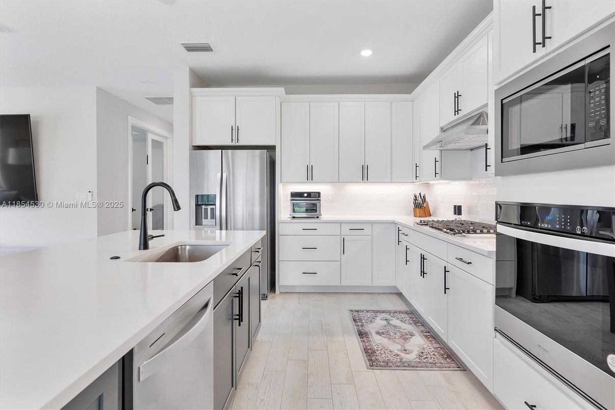 Interior, Kitchen, Recessed Lighting, Stainless Steel Appliances, Wood Texture Flooring