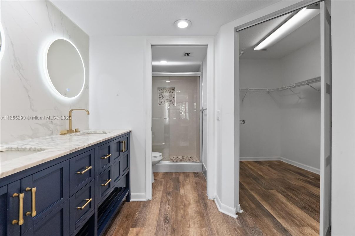 Bathroom, Glass Shower, Interior, Recessed Lighting, Walk-in Closets, Wood Texture Flooring