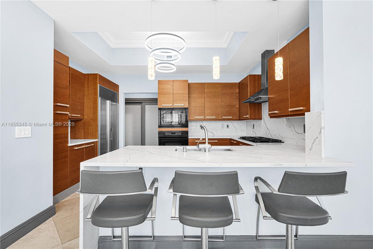 Interior, Kitchen, Marble Walls, Pendant Lights, Stainless Steel Appliances