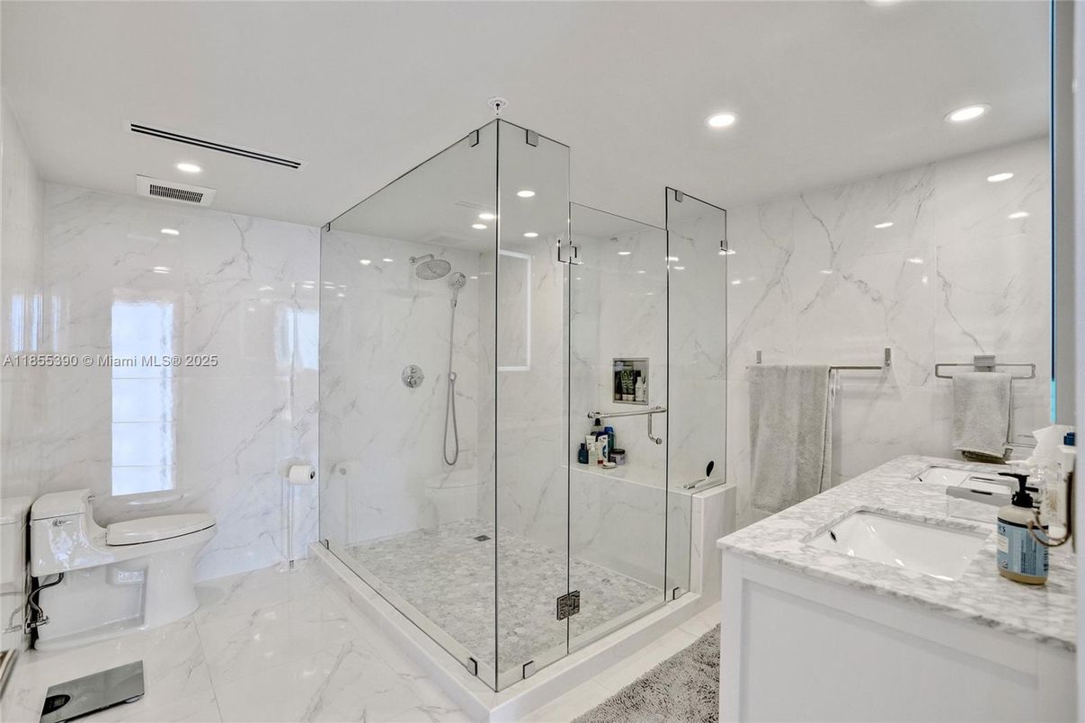 Bathroom, Dual Sink Vanities, Glass Shower, Interior, Marble, Marble Walls, Recessed Lighting