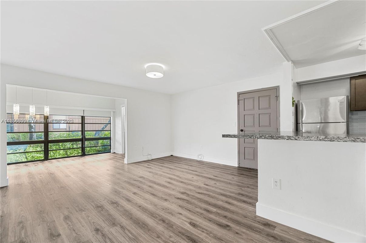 Empty room, Interior, Kitchen, Stainless Steel Appliances, Wood Texture Flooring
