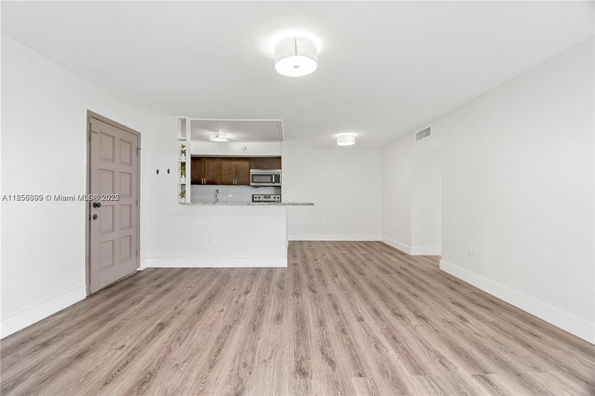 Empty room, Interior, Kitchen, Stainless Steel Appliances, Wood Texture Flooring