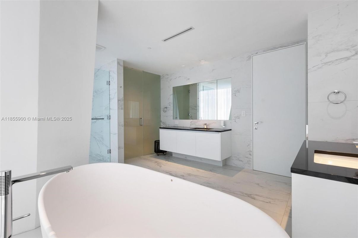 Bathroom, Free Standing Baths, Glass Shower, Interior, Marble, Marble Walls, Recessed Lighting