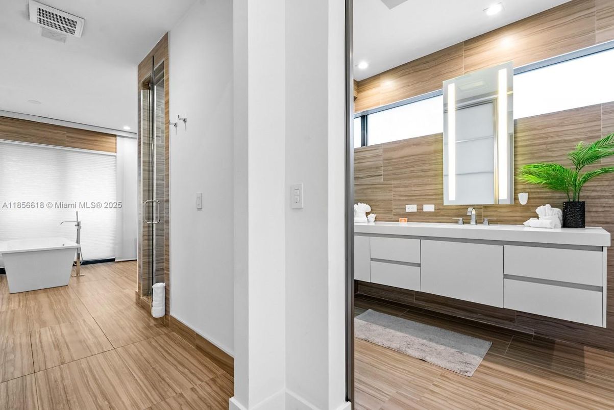 Bathroom, Dual Sink Vanities, Free Standing Baths, Interior, Recessed Lighting, Wood Texture Flooring, Wooden Walls