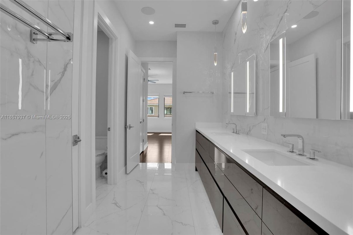 Bathroom, Dual Sink Vanities, Interior, Marble, Marble Walls, Recessed Lighting