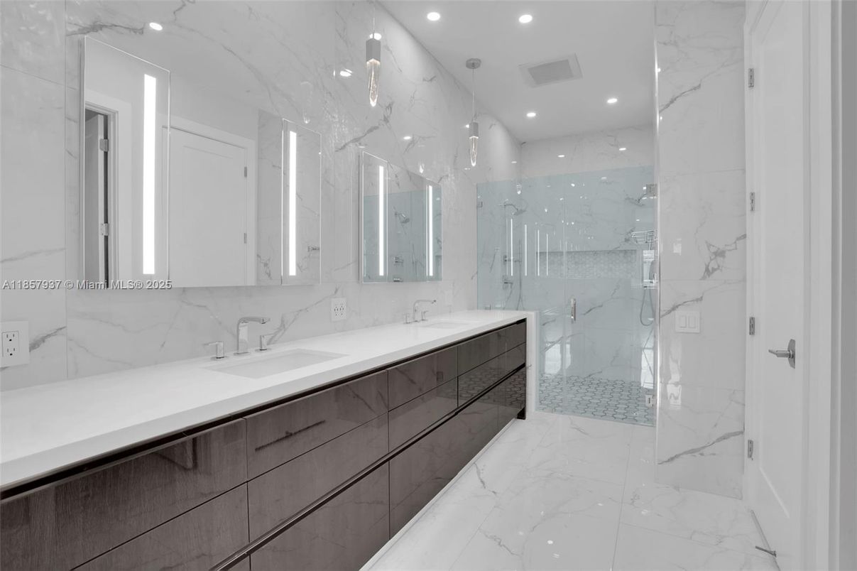 Bathroom, Dual Sink Vanities, Glass Shower, Interior, Marble, Marble Walls, Recessed Lighting