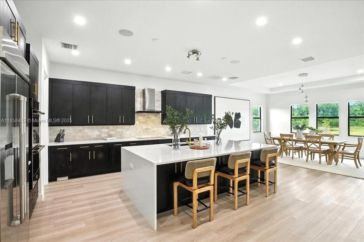 Dining room, Interior, Kitchen, Pendant Lights, Recessed Lighting, Stainless Steel Appliances, Wood Texture Flooring