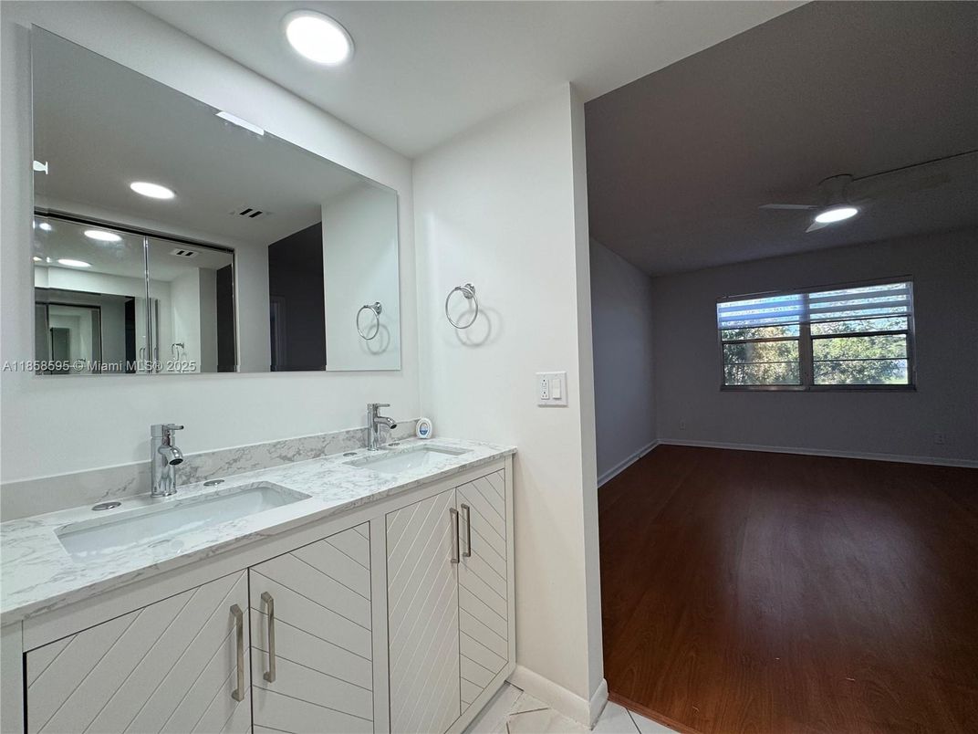 Bathroom, Dual Sink Vanities, Interior, Recessed Lighting, Wood Texture Flooring