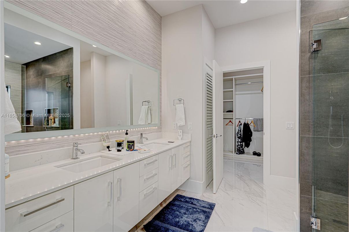 Bathroom, Dual Sink Vanities, Glass Shower, Interior, Marble, Recessed Lighting, Walk-in Closets