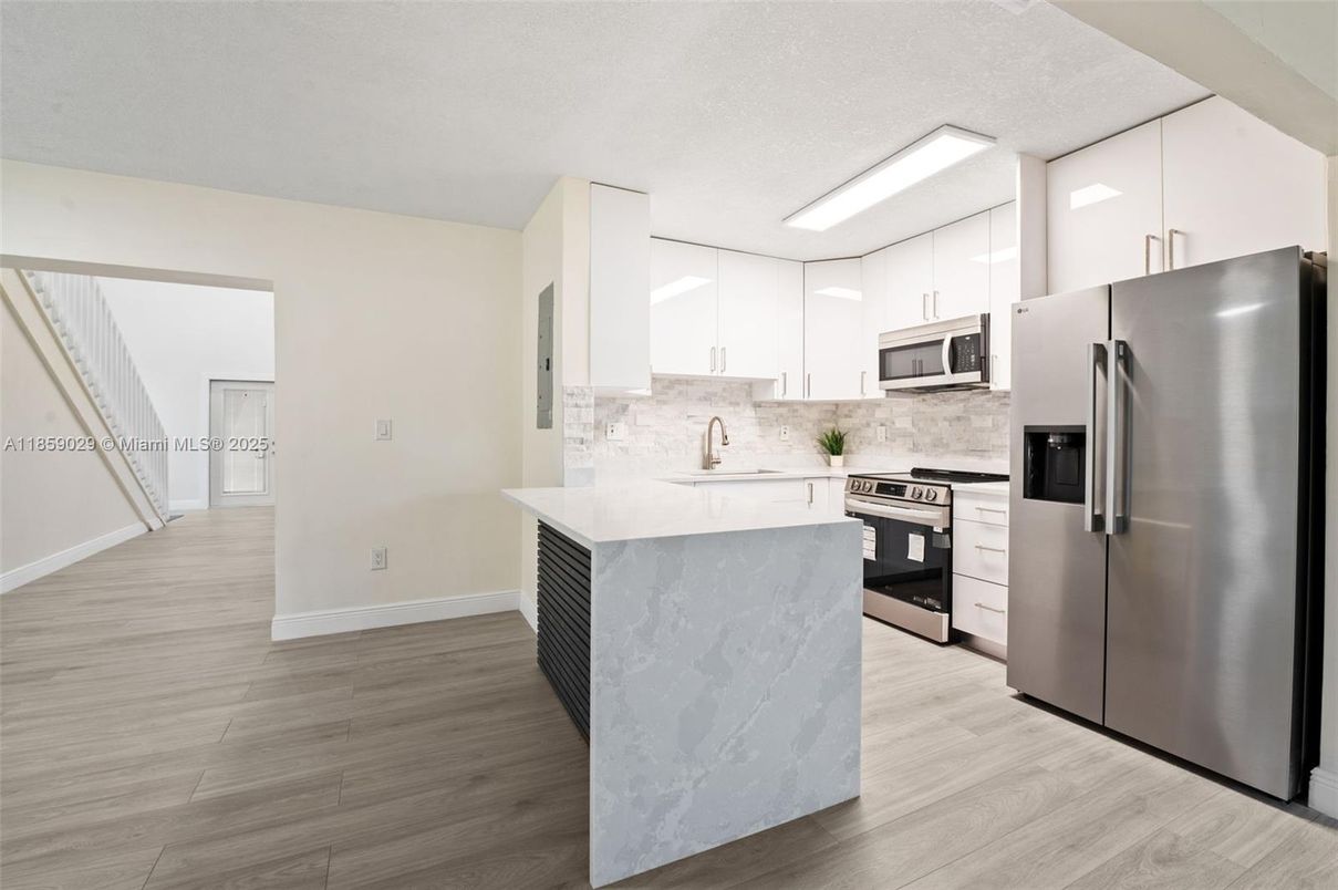Interior, Kitchen, Marble Walls, Stainless Steel Appliances, Wood Texture Flooring
