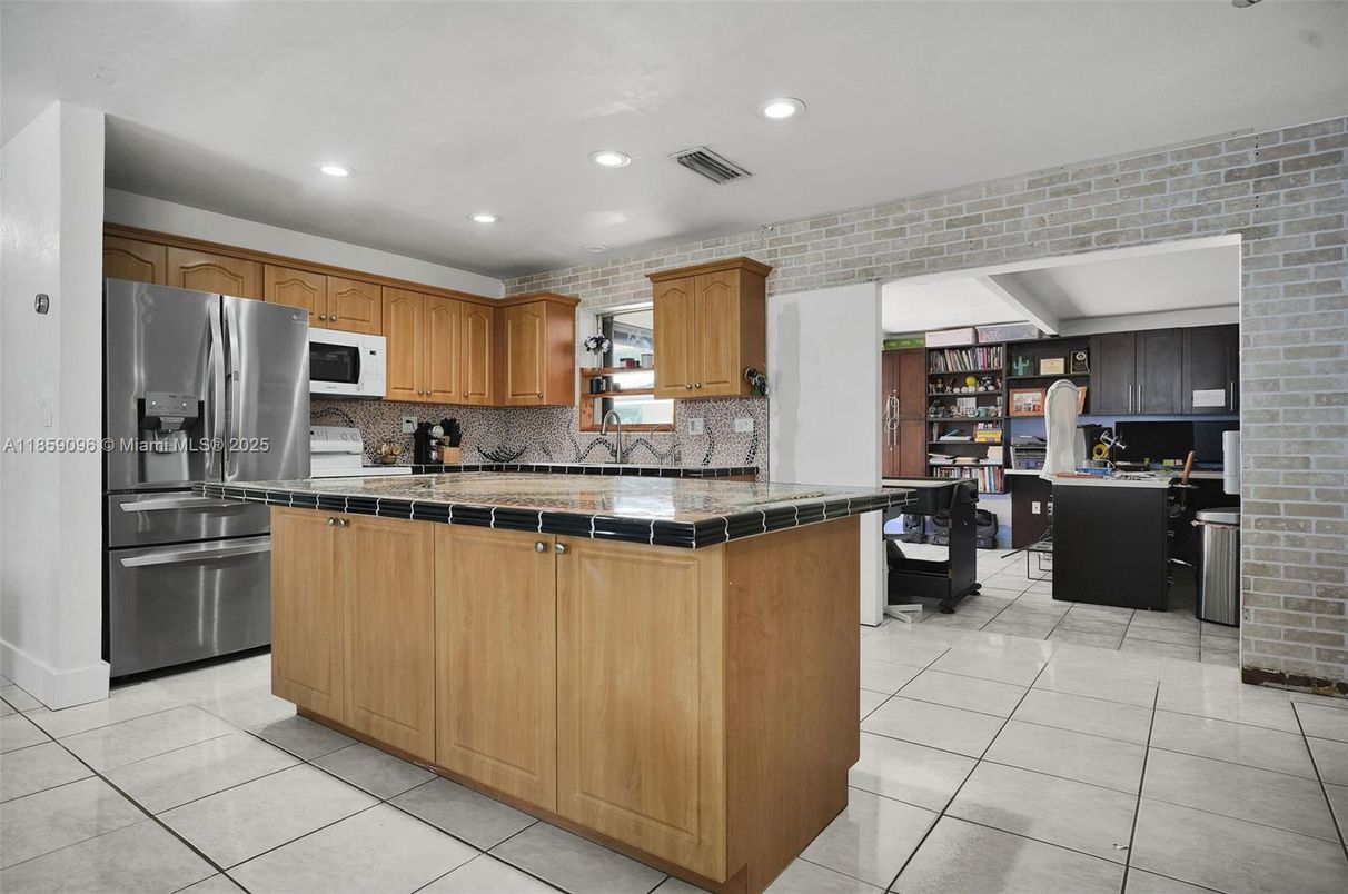 Dining room, Interior, Kitchen, Recessed Lighting, Stainless Steel Appliances, Stone Walls, Tile Countertops