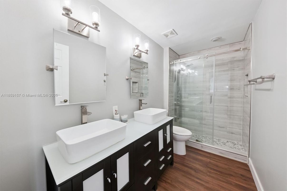 Bathroom, Dual Sink Vanities, Glass Shower, Interior, Wood Texture Flooring