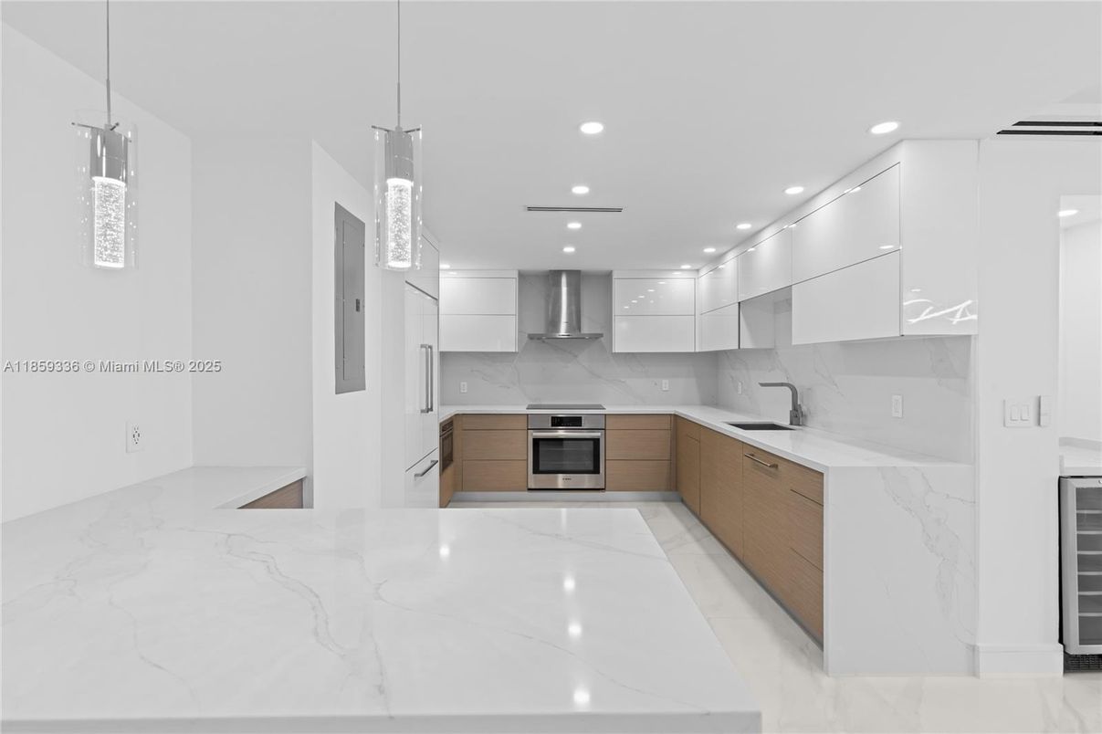 Interior, Kitchen, Marble, Marble Walls, Pendant Lights, Recessed Lighting, Stainless Steel Appliances