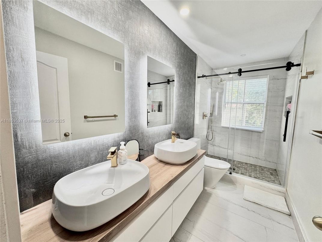 Bathroom, Dual Sink Vanities, Glass Shower, Interior, Marble, Recessed Lighting