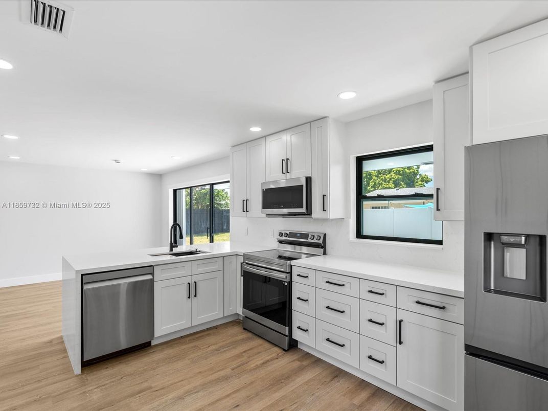 Interior, Kitchen, Recessed Lighting, Stainless Steel Appliances, Wood Texture Flooring