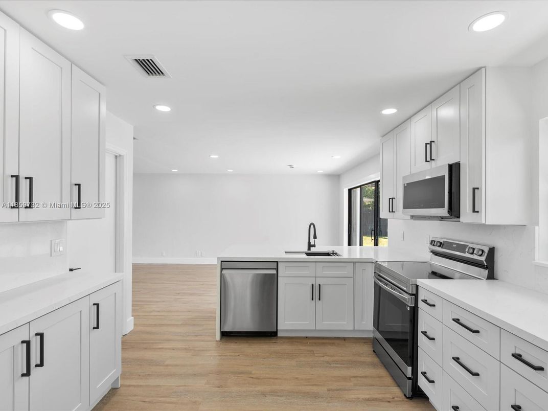 Interior, Kitchen, Recessed Lighting, Stainless Steel Appliances, Wood Texture Flooring