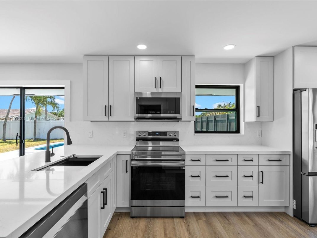 Interior, Kitchen, Recessed Lighting, Stainless Steel Appliances, Water, Wood Texture Flooring