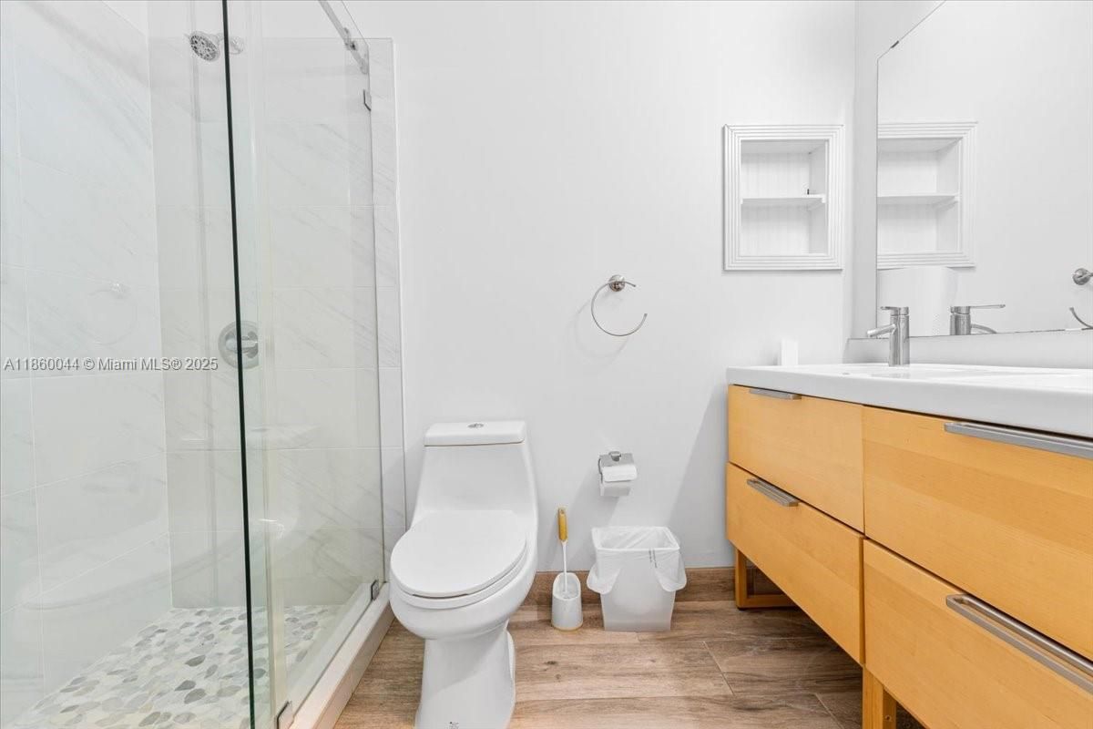 Bathroom, Glass Shower, Interior, Marble Walls, Wood Texture Flooring