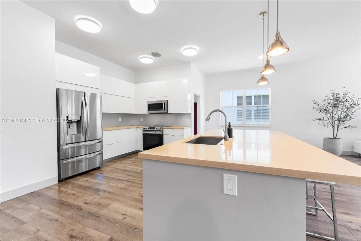 Interior, Kitchen, Pendant Lights, Stainless Steel Appliances, Wood Texture Flooring