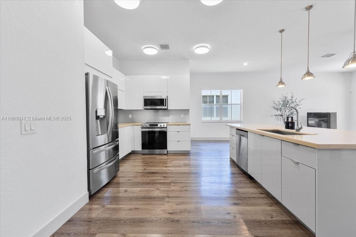 Interior, Kitchen, Pendant Lights, Recessed Lighting, Stainless Steel Appliances, Wood Texture Flooring