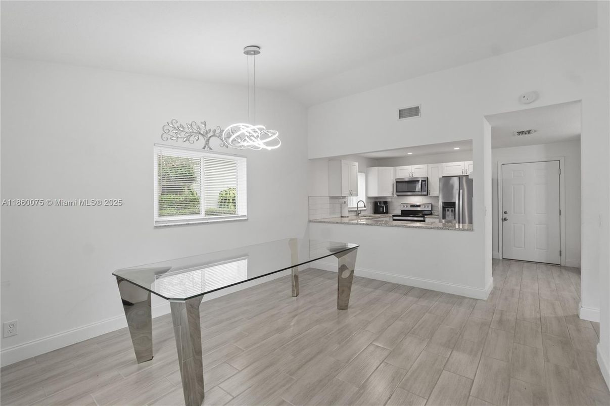 Dining room, Interior, Kitchen, Pendant Lights, Recessed Lighting, Stainless Steel Appliances, Wood Texture Flooring
