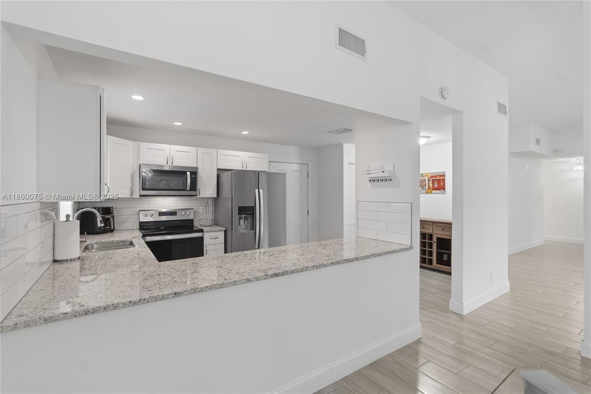 Interior, Kitchen, Recessed Lighting, Stainless Steel Appliances, Wood Texture Flooring