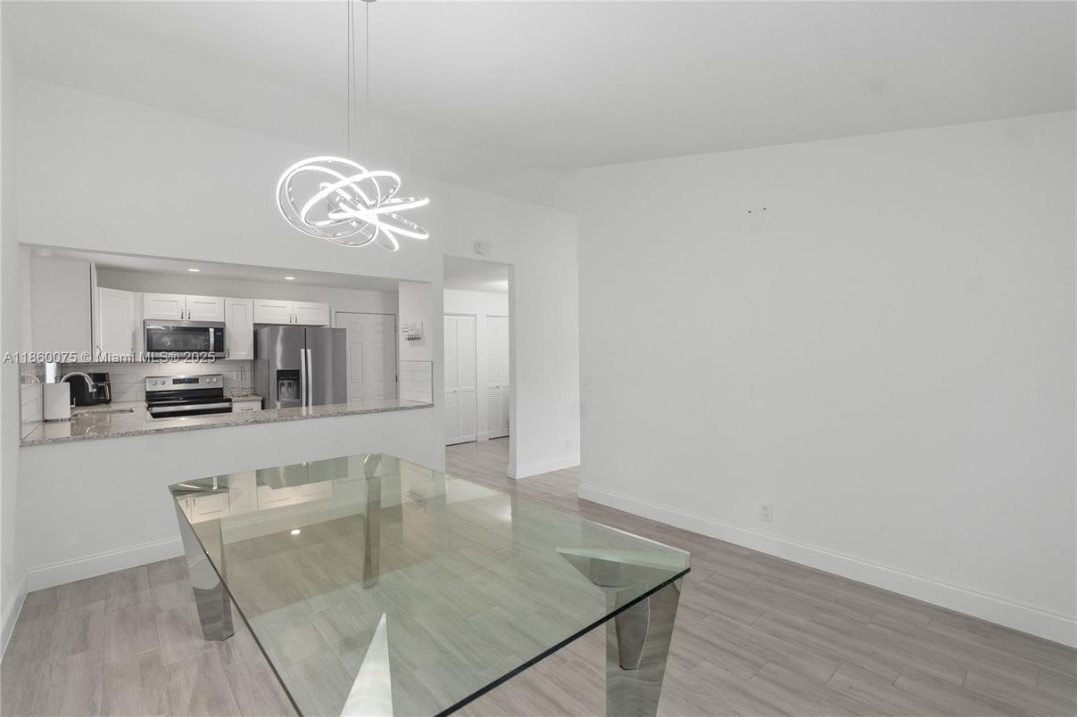 Dining room, Interior, Kitchen, Pendant Lights, Recessed Lighting, Stainless Steel Appliances, Wood Texture Flooring