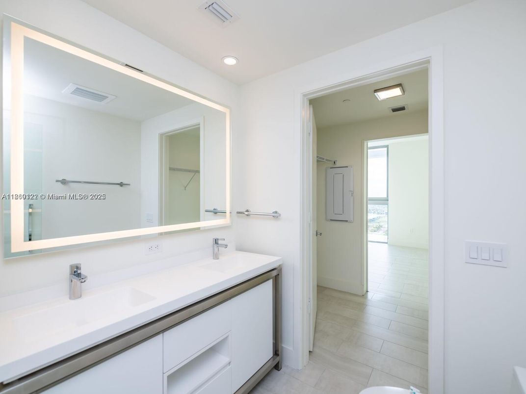 Bathroom, Dual Sink Vanities, Interior, Recessed Lighting, Wood Texture Flooring