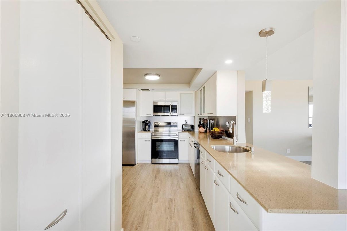 Interior, Kitchen, Pendant Lights, Recessed Lighting, Stainless Steel Appliances, Wood Texture Flooring