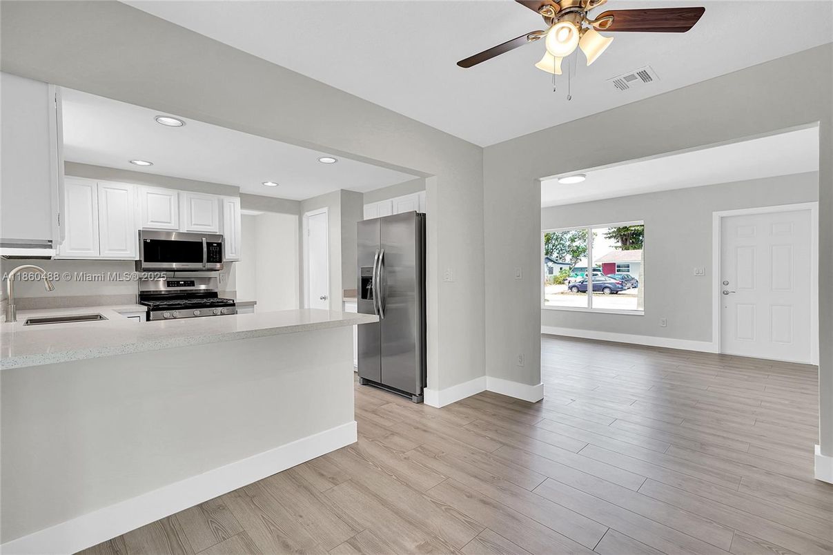 Interior, Kitchen, Recessed Lighting, Stainless Steel Appliances, Wood Texture Flooring