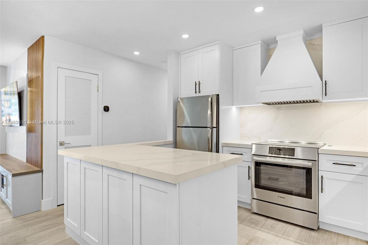 Interior, Kitchen, Marble Walls, Recessed Lighting, Stainless Steel Appliances, Wood Texture Flooring