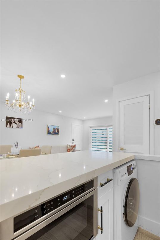 Chandelier, Interior, Kitchen, Recessed Lighting, Washer, Wood Texture Flooring