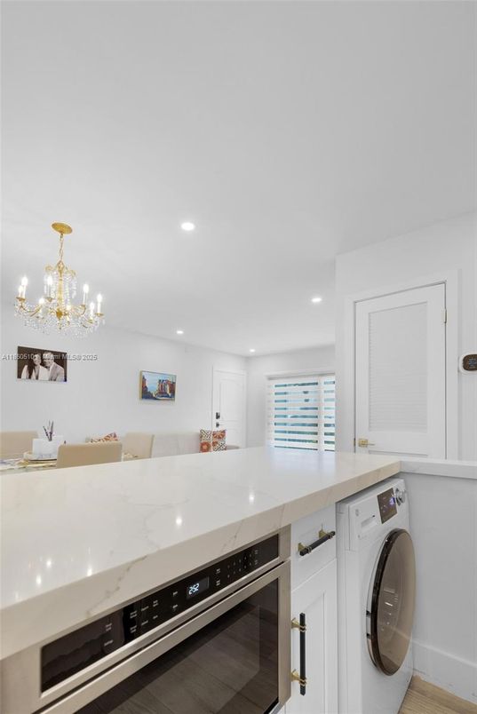 Chandelier, Interior, Kitchen, Recessed Lighting, Washer, Wood Texture Flooring